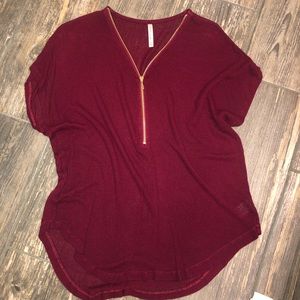 Maroon top with gold zipper
